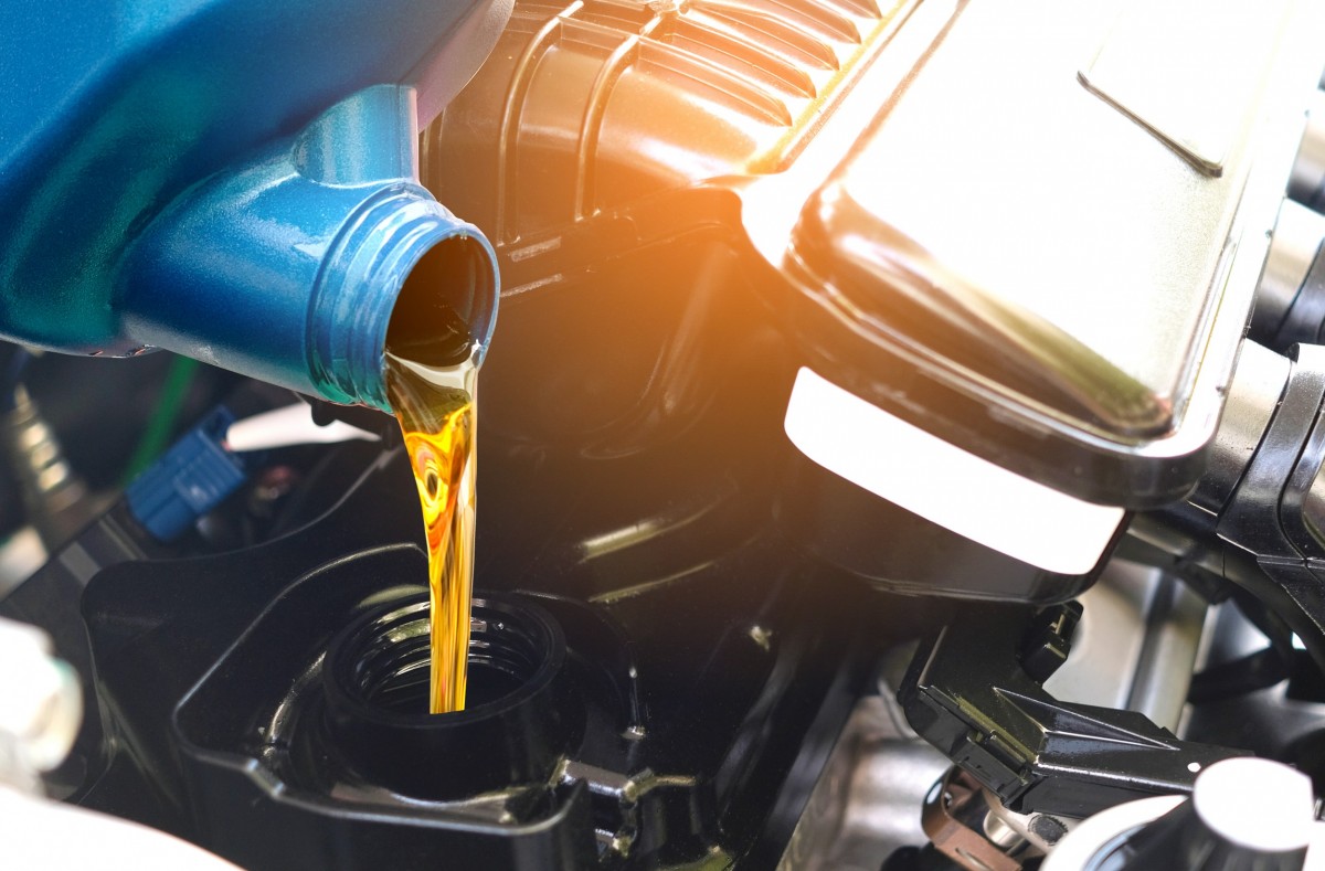 oil being poured into car