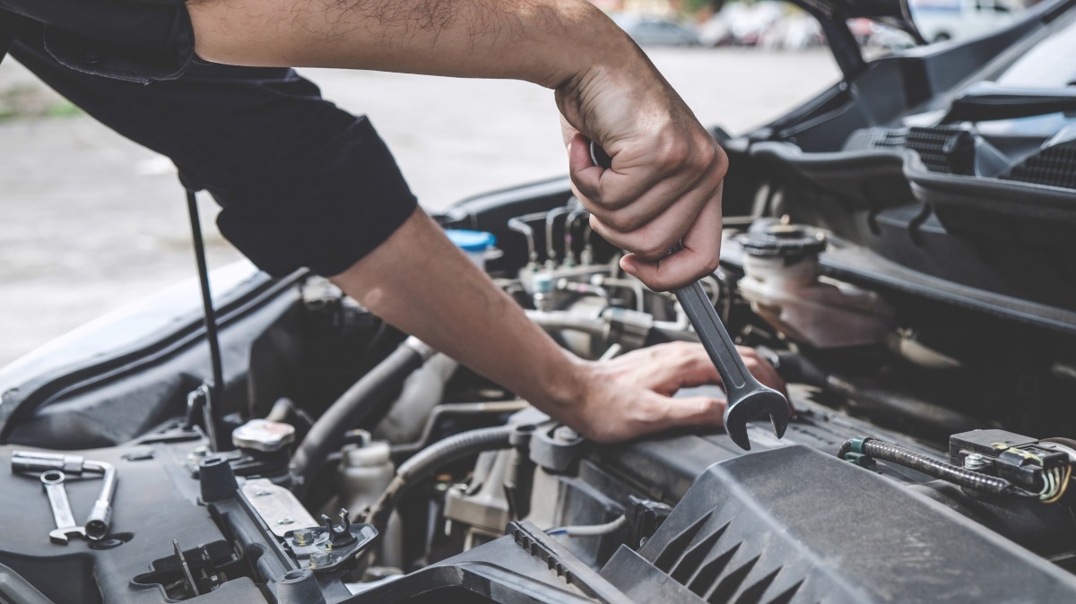 mechanic working on vehicle