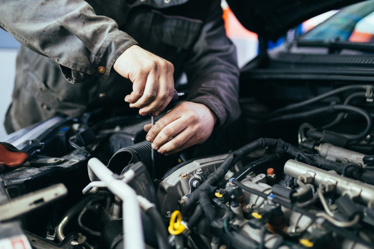 mechanic working on vehicle