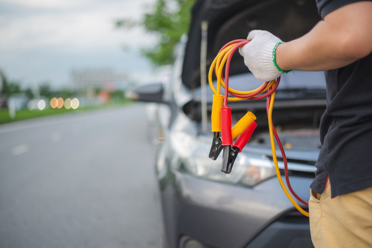 Man with jumper cables