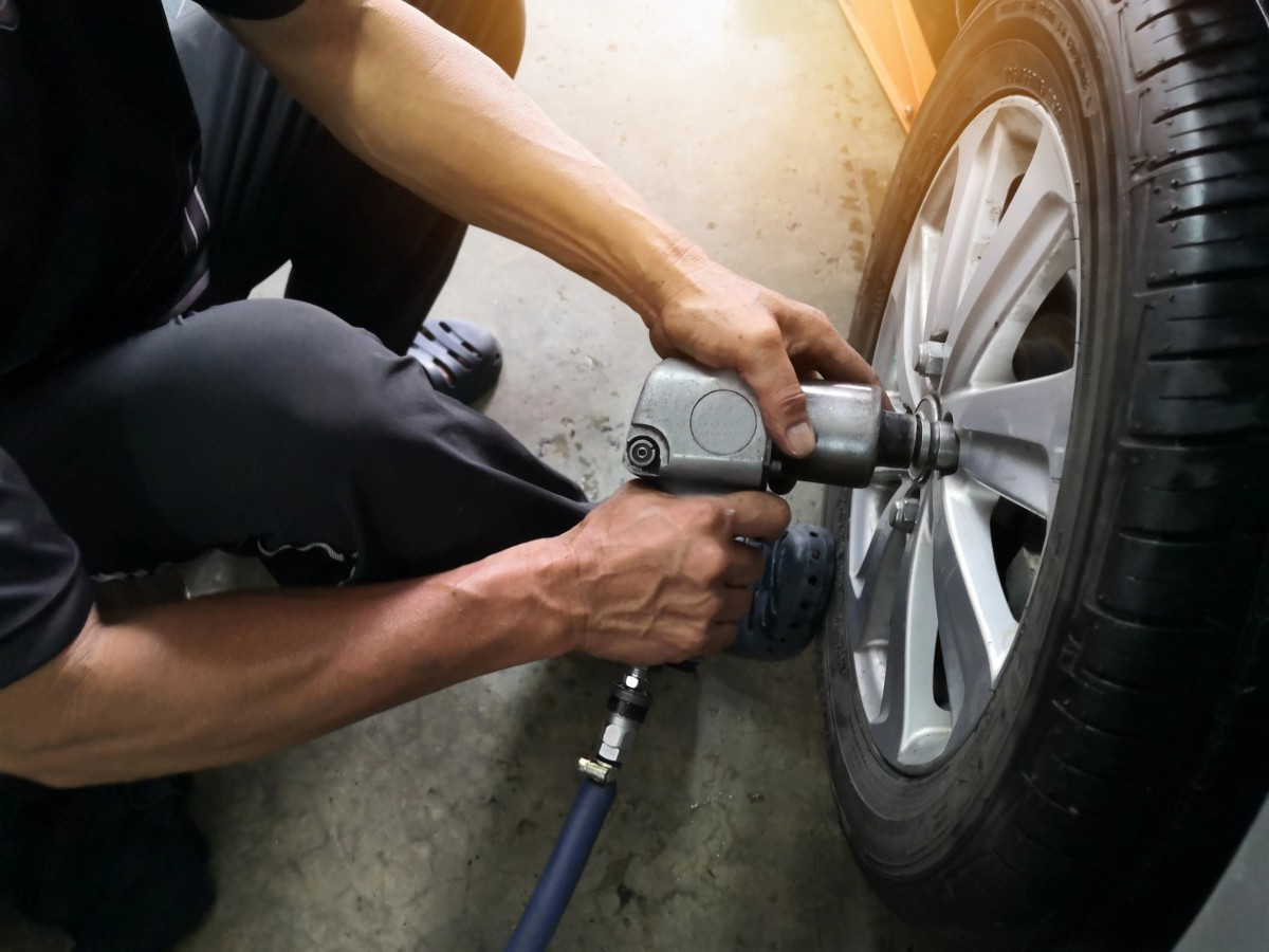 man working on tire