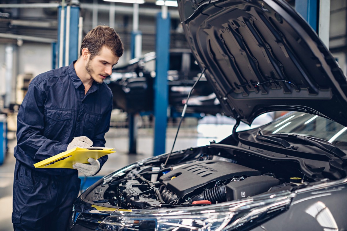 technician checking the engine